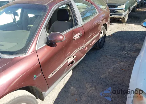 2000 Ford Taurus Se z USA, uszkodzony, nr VIN 1FAFP5821YA156682